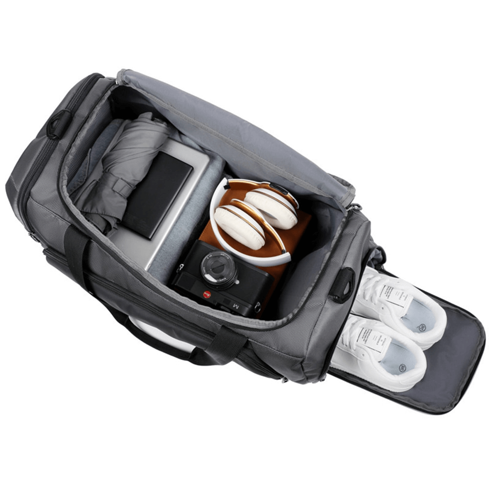 Open sports waterproof portable bag showing compartments with shoes, gadgets, and headphones, perfect for fitness activities. Model SF0874.